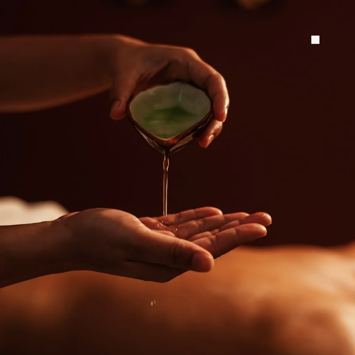 Aromatherapy oil being poured during Nami Thai Aroma at Nami Thai Massage & Spa